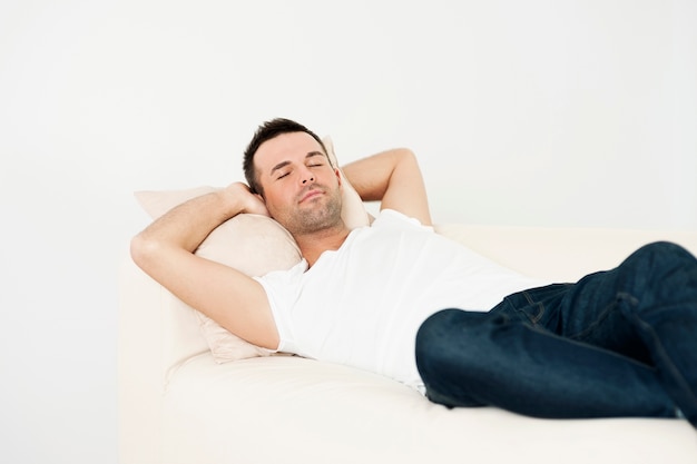 Handsome man sleeping on couch