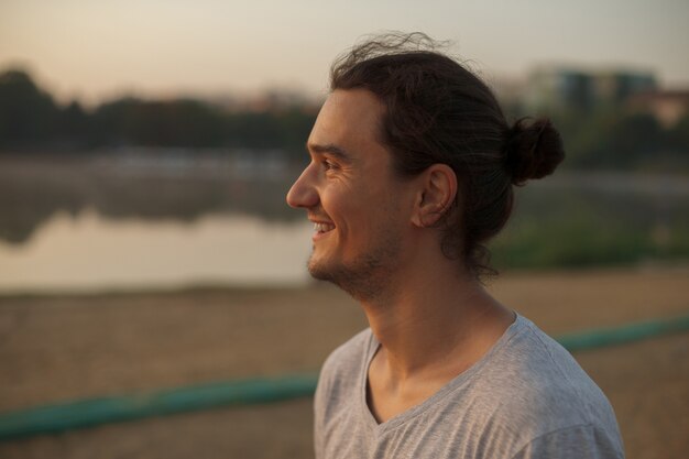 Handsome man smiling in the park