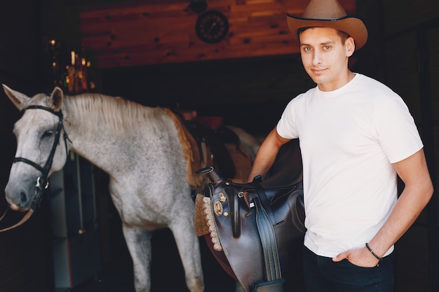 Free photo handsome man spending time with a horse