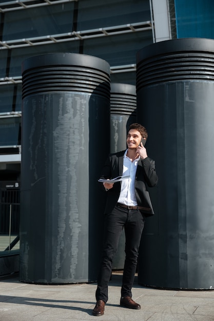 Handsome man talking on phone