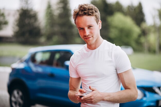 Handsome man tourist buying a car