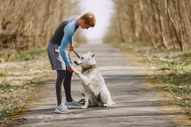 Handsome man training in a summer forest