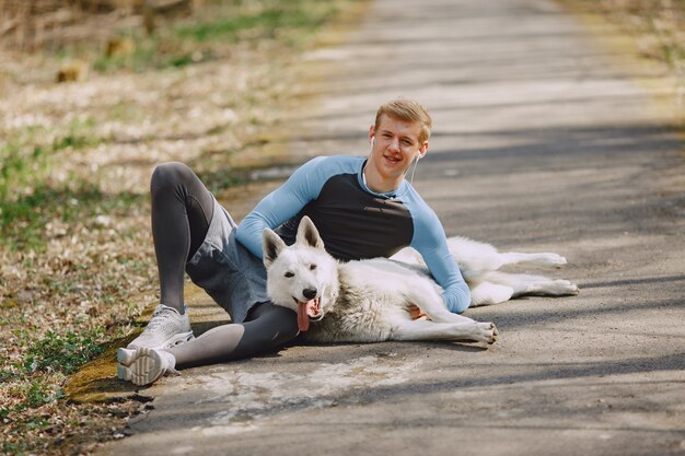 Handsome man training in a summer forest