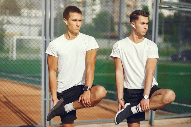 Handsome man training in a summer park