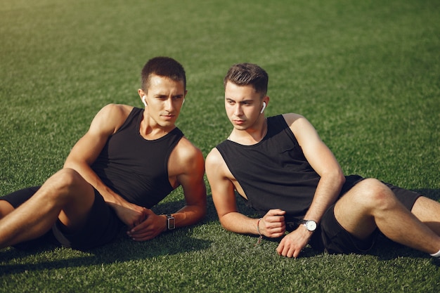 Handsome man training in a summer park