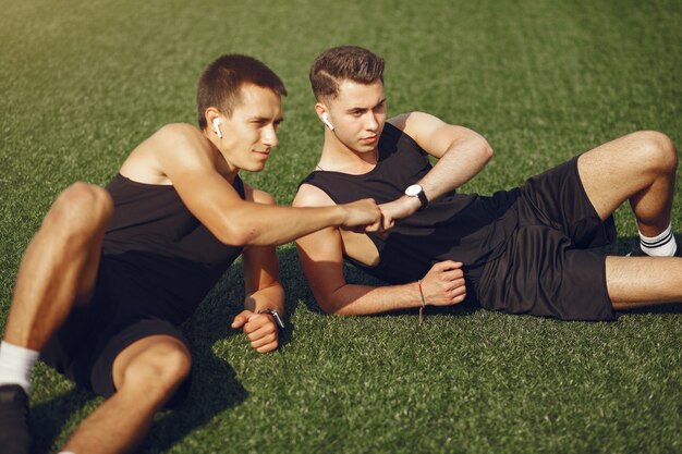 Free photo handsome man training in a summer park