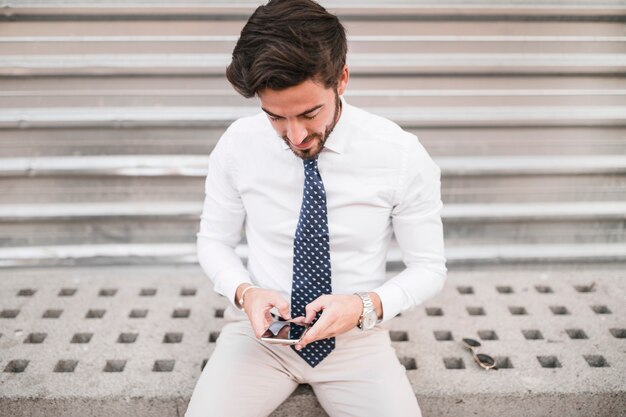 Handsome man using mobile phone