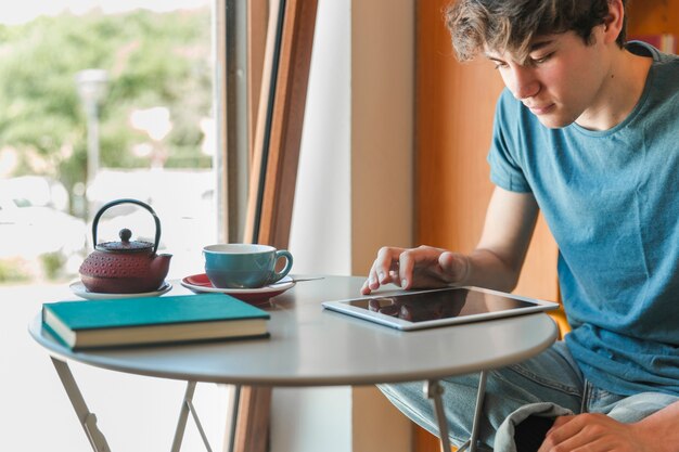 Handsome man using tablet