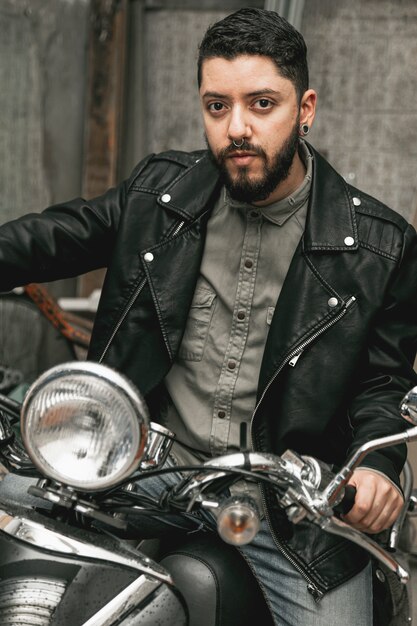 Handsome man on vintage motorcycle