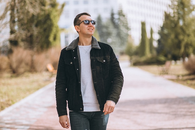 Handsome man walking in park