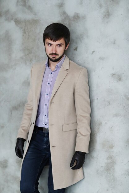 Handsome man wearing beige coat