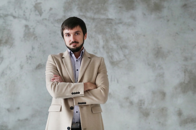 Handsome man wearing beige coat