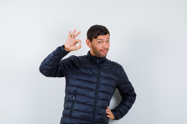 handsome man wearing a bomber jacket