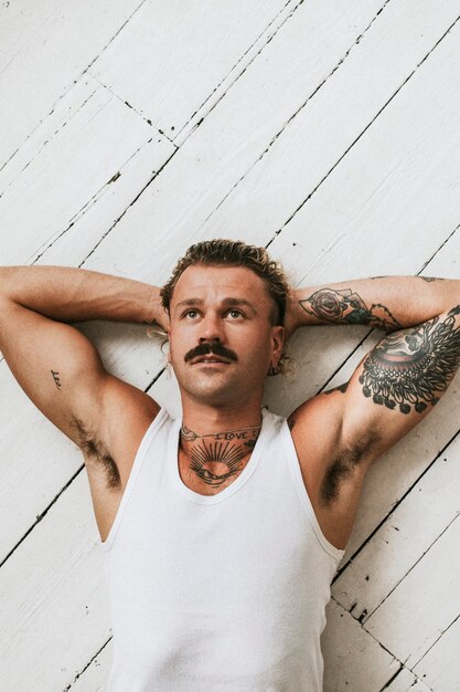 Handsome man in white tank top fashion shot