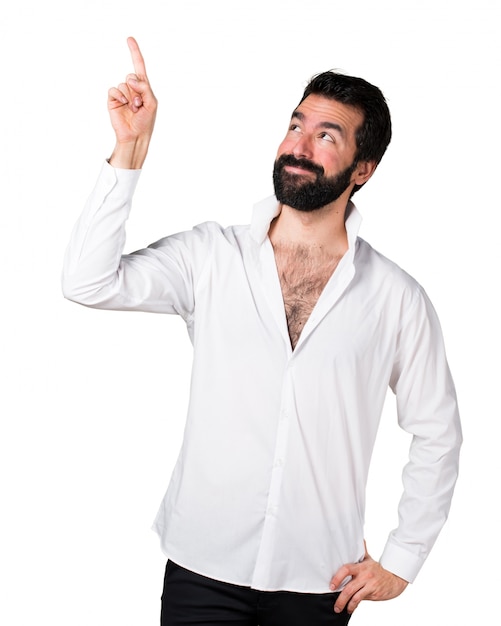 Handsome man with beard pointing up