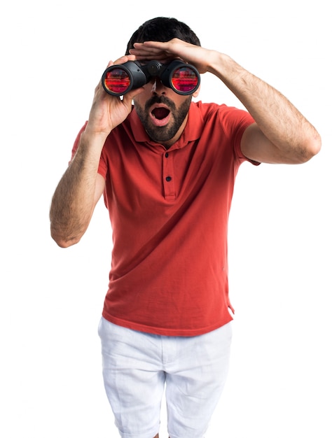 Free photo handsome man with binoculars