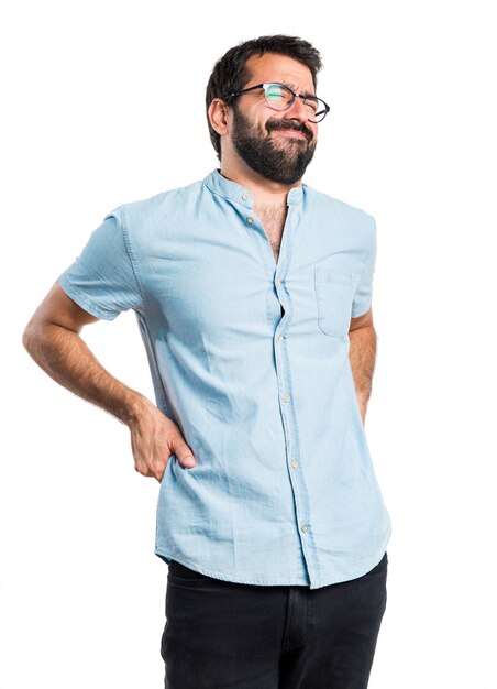 Handsome man with blue glasses with back pain