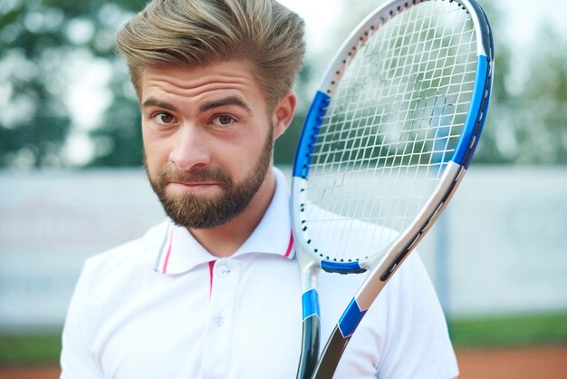 Handsome man with the racket