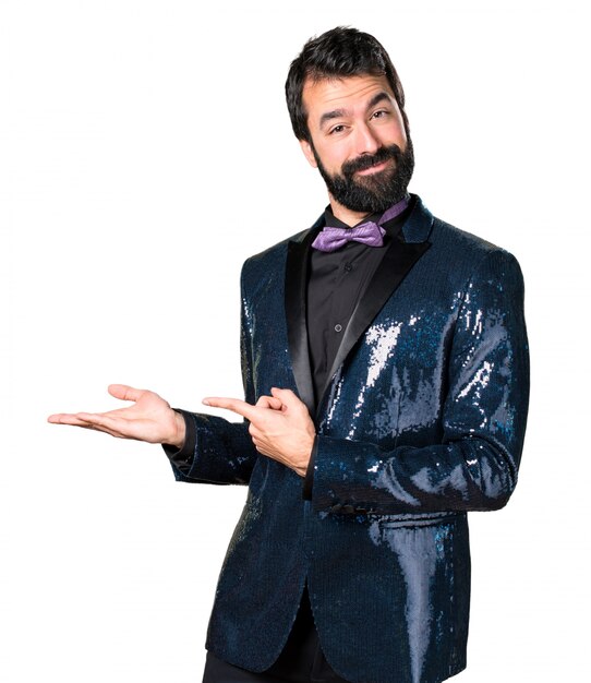 Handsome man with sequin jacket holding something
