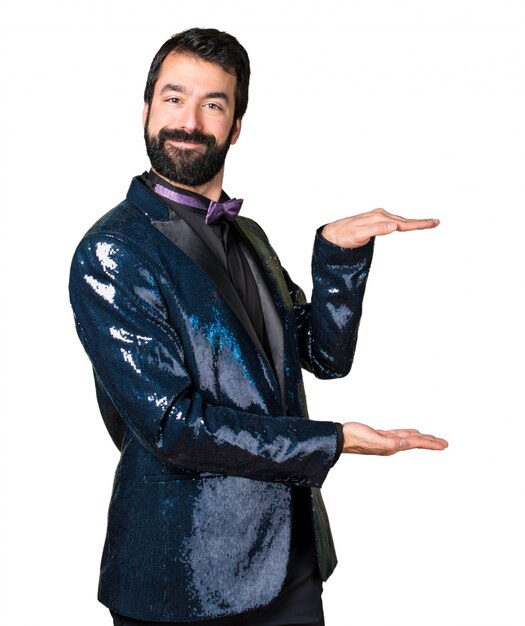 Handsome man with sequin jacket holding something