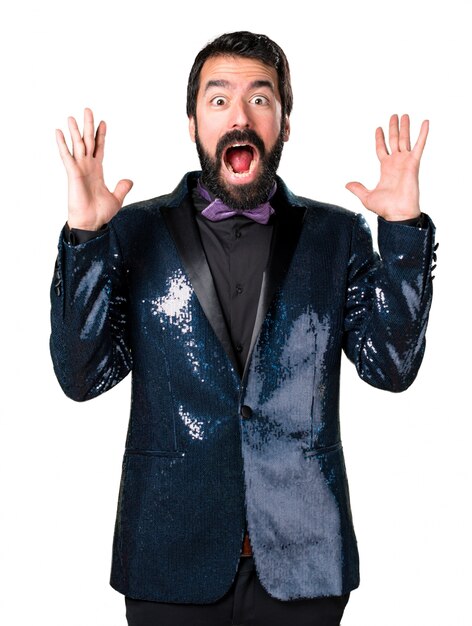 Handsome man with sequin jacket making surprise gesture