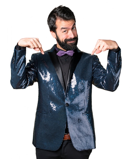 Free photo handsome man with sequin jacket pointing down