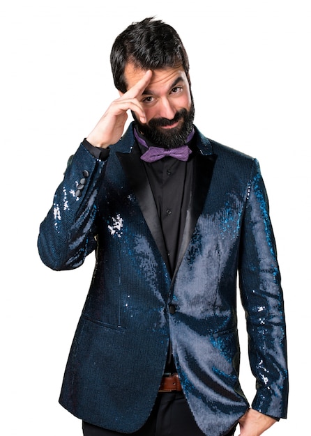 Free photo handsome man with sequin jacket saluting