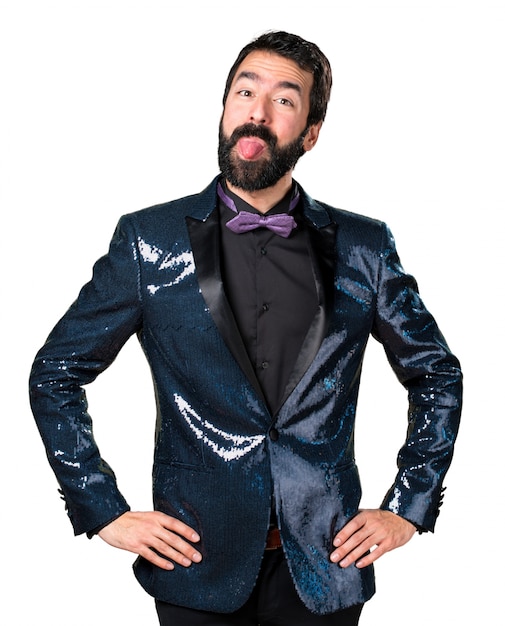 Free photo handsome man with sequin jacket taking out his tongue