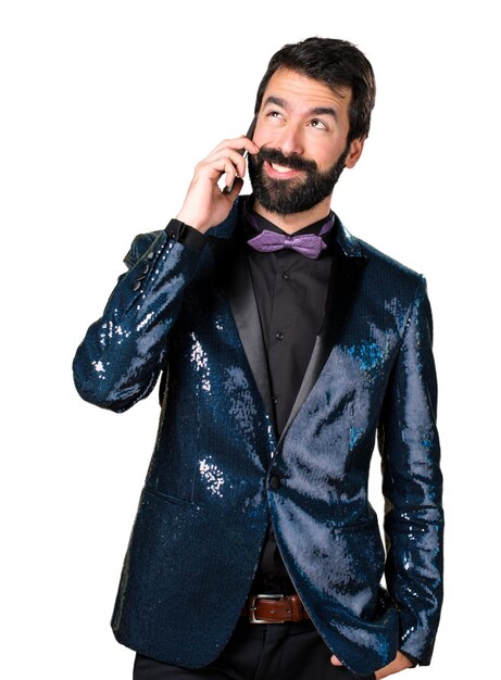 Handsome man with sequin jacket talking to mobile