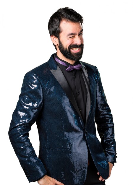 Handsome man with sequin jacket winking