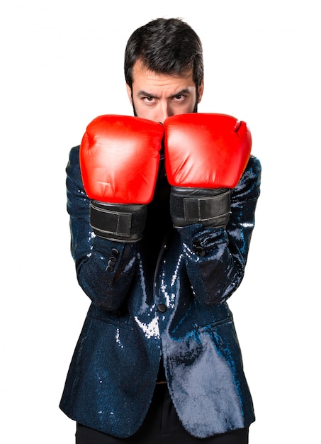 Free photo handsome man with sequin jacket with boxing gloves