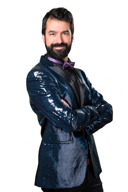 Handsome man with sequin jacket with his arms crossed