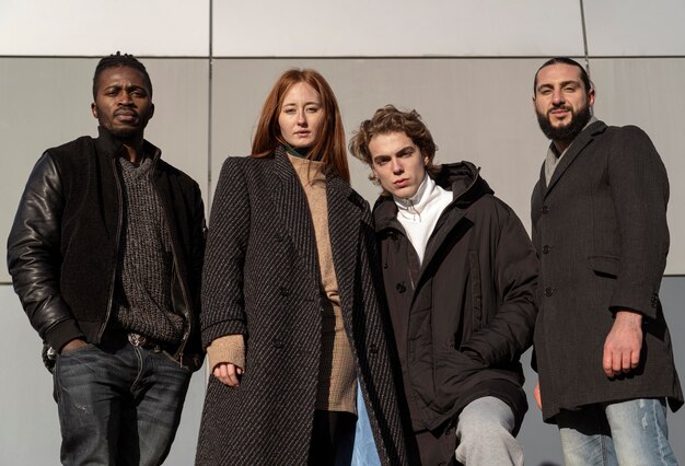 Handsome men and beautiful woman outside in the sun