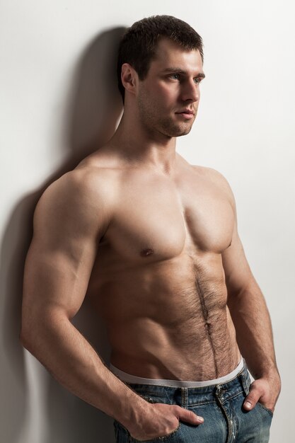 Handsome muscular guy with naked torso