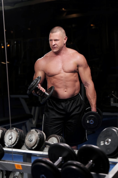 Handsome muscular man at a gym