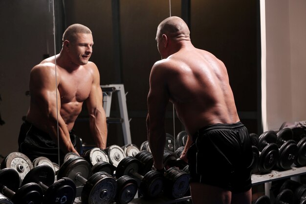 Handsome muscular man at a gym