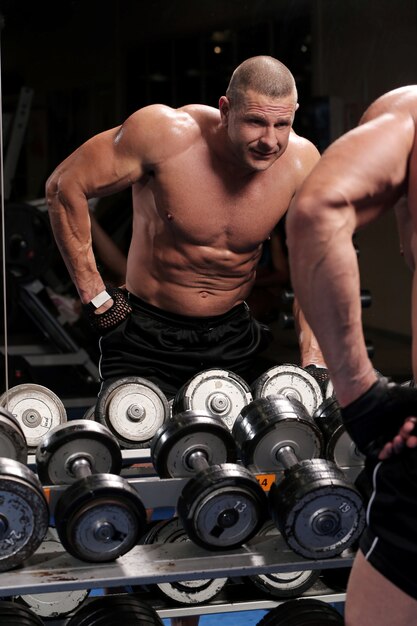 Handsome muscular man at a gym