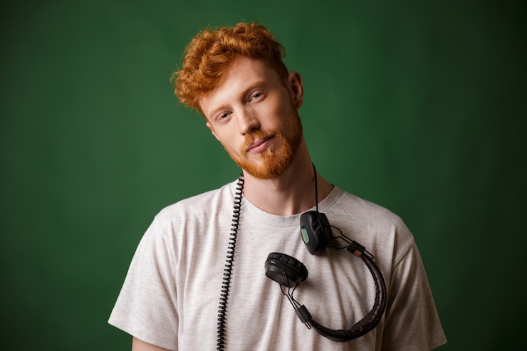 Free Photo handsome readheah bearded man in white tshirt with headphones