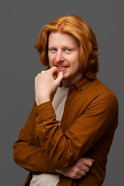 Handsome and sensitive red head man smiling