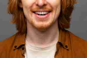 Free photo handsome and sensitive red head man smiling