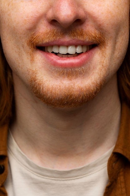 Handsome and sensitive red head man smiling