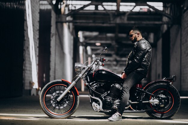 Handsome sexy man on motorbike