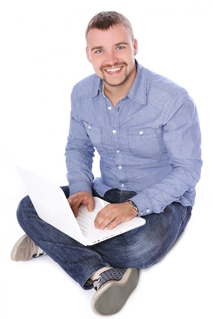 Handsome smiling guy with laptop