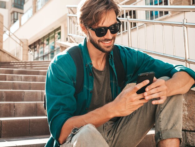 Handsome stylish smiling hipster lambersexual model