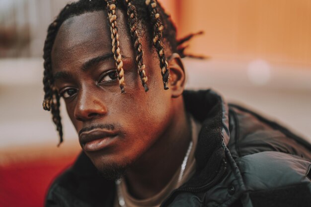 Handsome stylish Spanish man with dreads posing outdoor