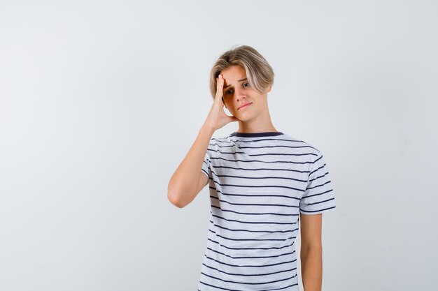 Handsome teen boy in a striped t-shirt