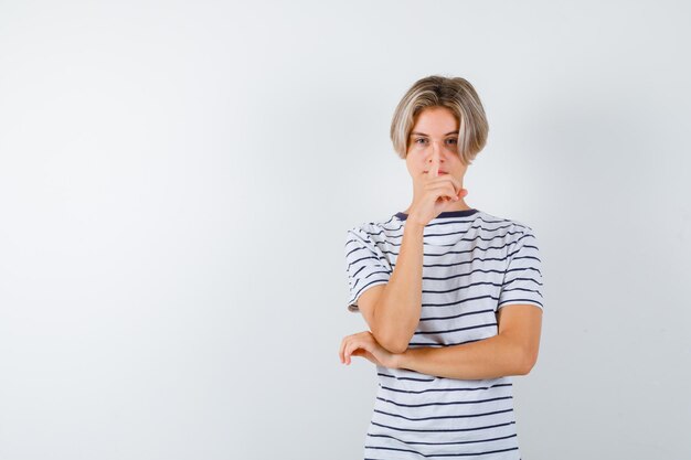 Free photo handsome teen boy in a striped t-shirt