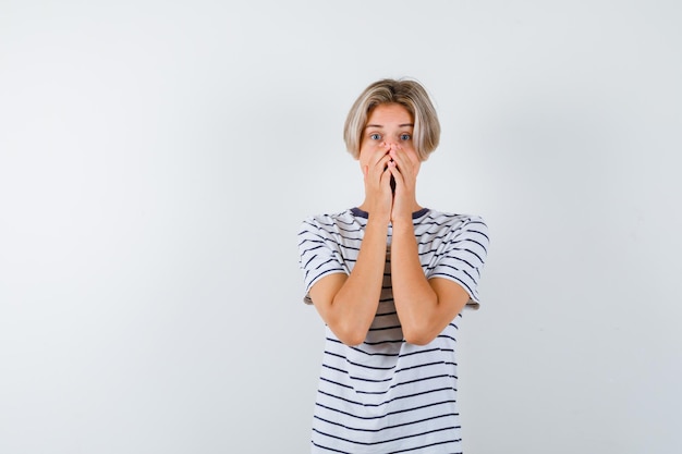 Free photo handsome teen boy in a striped t-shirt