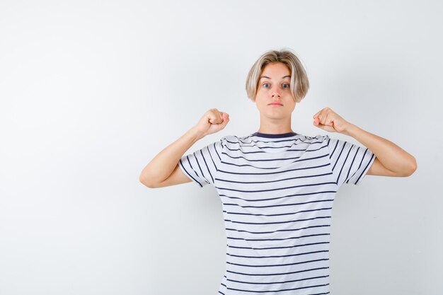 Handsome teen boy in a striped t-shirt