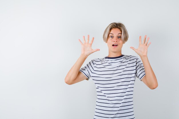 Handsome teen boy in a striped t-shirt